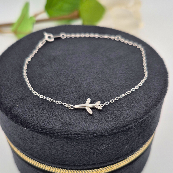 Silver airplane charm bracelet UK close up — Travel Vine CZ chain bracelet — Lilies of the Valley